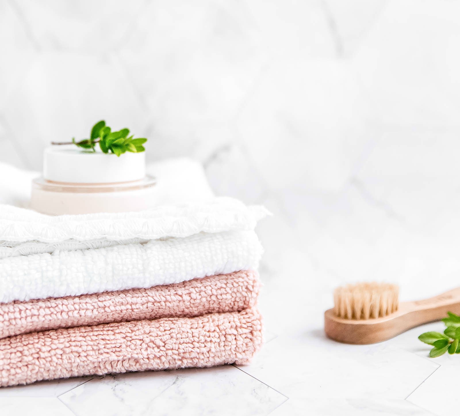 https://www.getgreenbewell.com/wp-content/uploads/2018/10/Hand-towels-and-brush-on-white-countertop.jpg